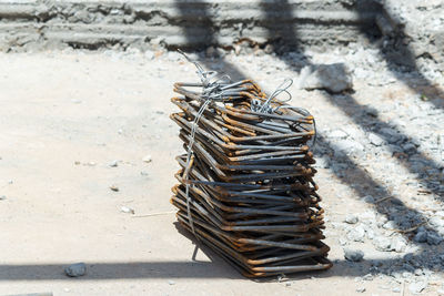 High angle view of firewood on sand