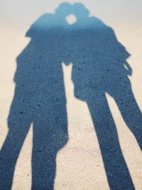 Shadow of people on sand