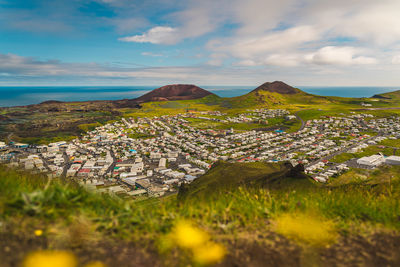 Houses in town against sky