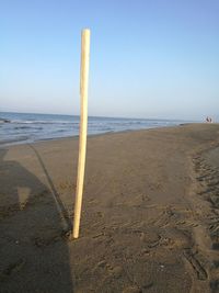 Scenic view of beach against clear sky