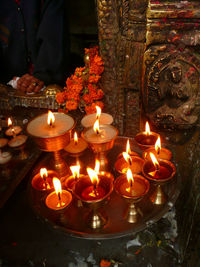 Fire lit candles at night