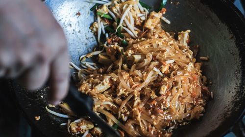 High angle view of food on cutting board.pad thai