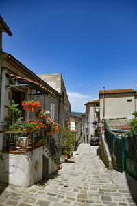 A narrow street between the old houses of marsicovetere, a village  of potenza province, italy.
