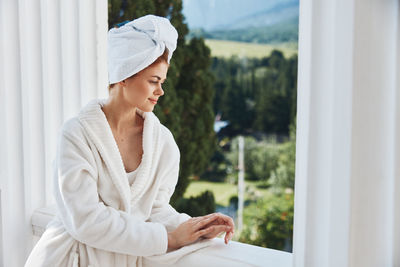 Young woman using laptop at home