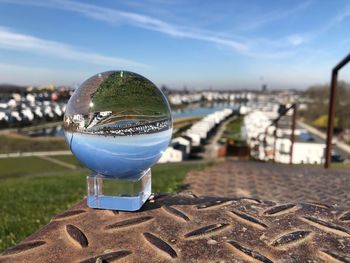 Close-up of glass against blue sky