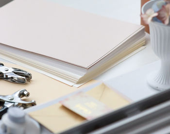 High angle view of man reading book on table