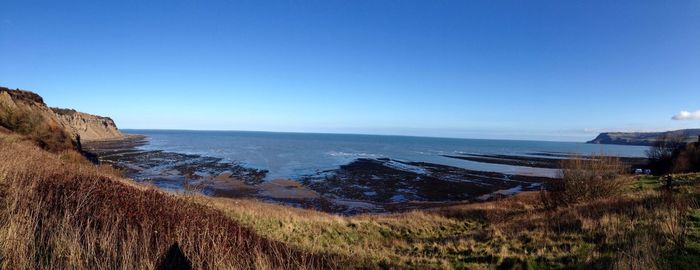 Scenic view of sea against clear sky