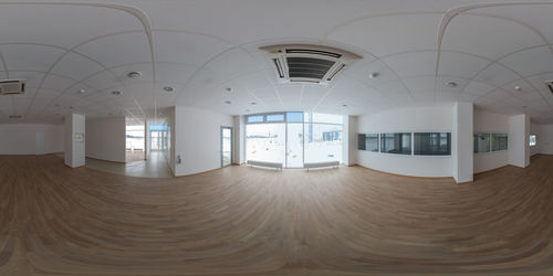 360 degree panorama in equirectangular projection of empty small office room in industrial building