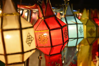 Close-up of illuminated lanterns hanging on christmas lights