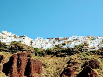 Panoramic view of residential district against clear blue sky