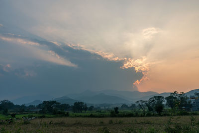 Scenic view of field against sky during sunset