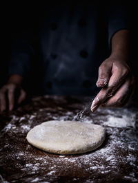 Midsection of person preparing food