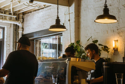 Rear view of people sitting in restaurant