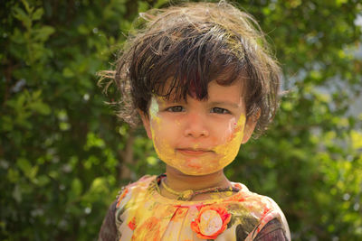 Close-up portrait of boy during holi