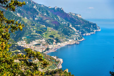 High angle view of townscape by sea