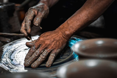 Close-up of man preparing food