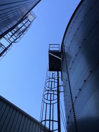 Low angle view of built structure against clear blue sky