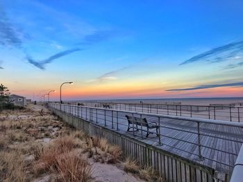 Scenic view of beach against sky during sunset