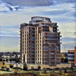 Exterior of apartment building against cloudy sky