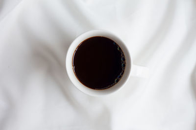 High angle view of coffee cup on table