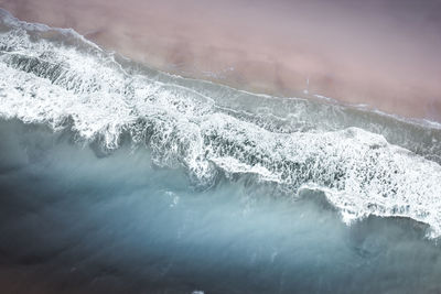 Aerial view of sea waves during winter