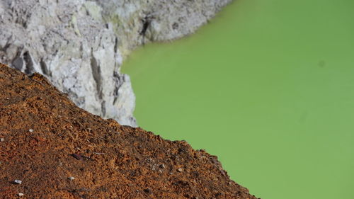 Close-up of rock formation in water