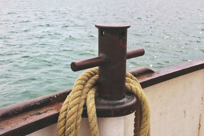 Close-up of rope tied on railing