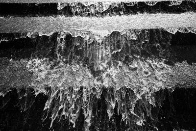 Full frame shot of icicles on rock