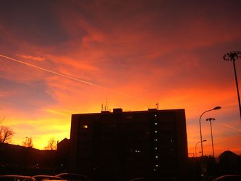 Cars on street at sunset