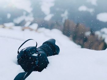 Close-up of camera on snow