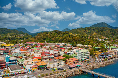 High angle view of townscape and mountains against sky