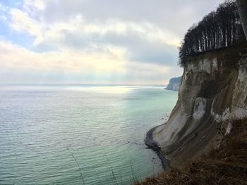 Scenic view of sea against cloudy sky