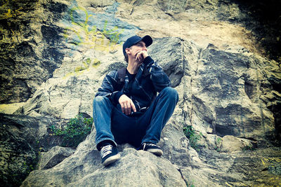 Man sitting on rock