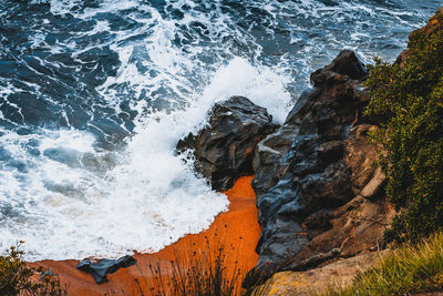 High angle view of rock formation on sea