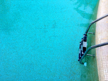 Close-up of ladder in swimming pool