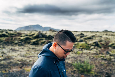 Person relaxing on mountain