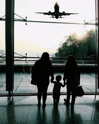 Silhouette of people at sunset