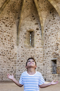 Portrait of a boy looking up