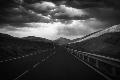 Surface level of road against mountain range, fuerteventura.