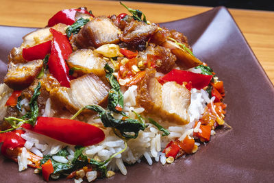 Stir fried crispy pork basil with rice