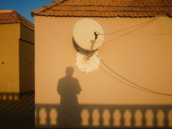 Mid adult man against sky during sunset