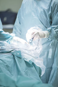 Midsection of surgeon working in operating room