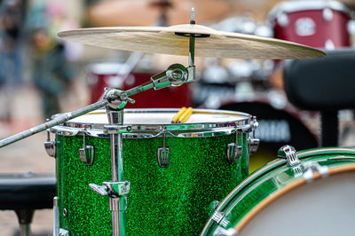 A set of plates in a drum set. at a concert of percussion music, selective focus, close-up