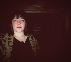 Portrait of woman standing at home