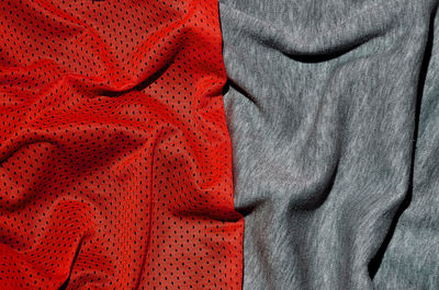 Close-up of crumpled red and gray textile