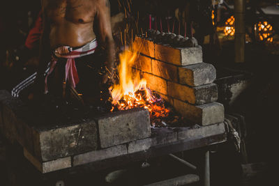 Bonfire on wooden log at night