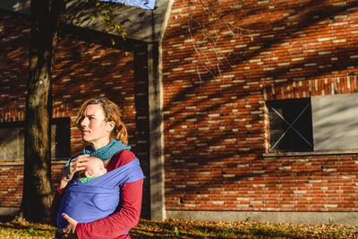 Woman with daughter outdoors