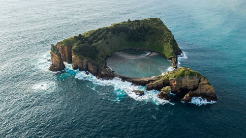 High angle view of rock on sea shore