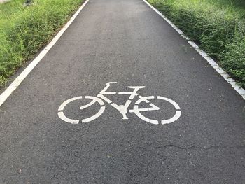 High angle view of bicycle sign on road