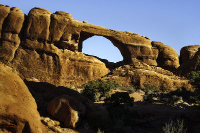 View of rock formation against clear sky